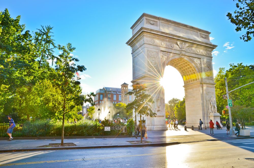 The Washington Square Arch in Washington Square Park on a sunny day, near the James NoMad