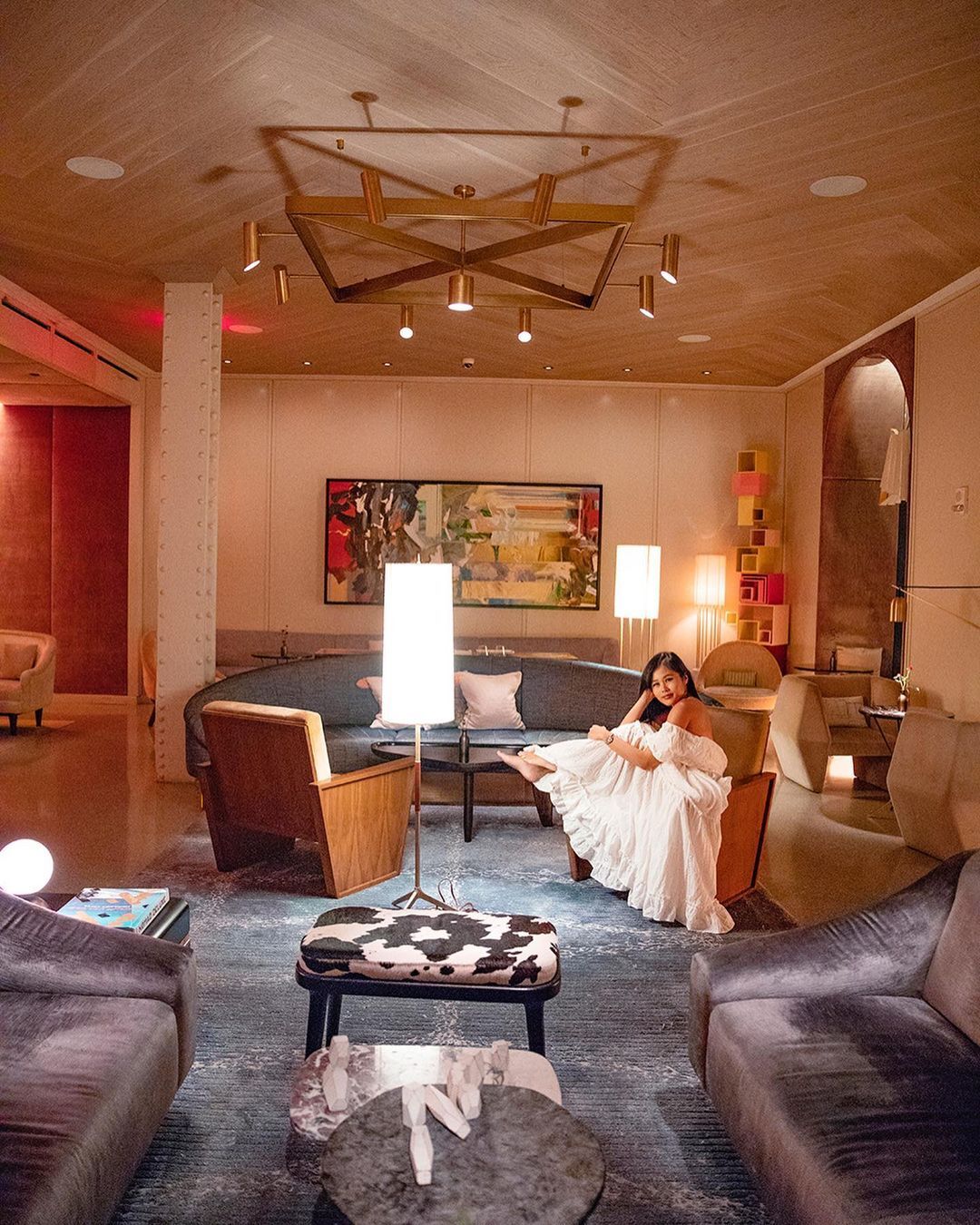 A lady sits in the lobby of The James NoMad